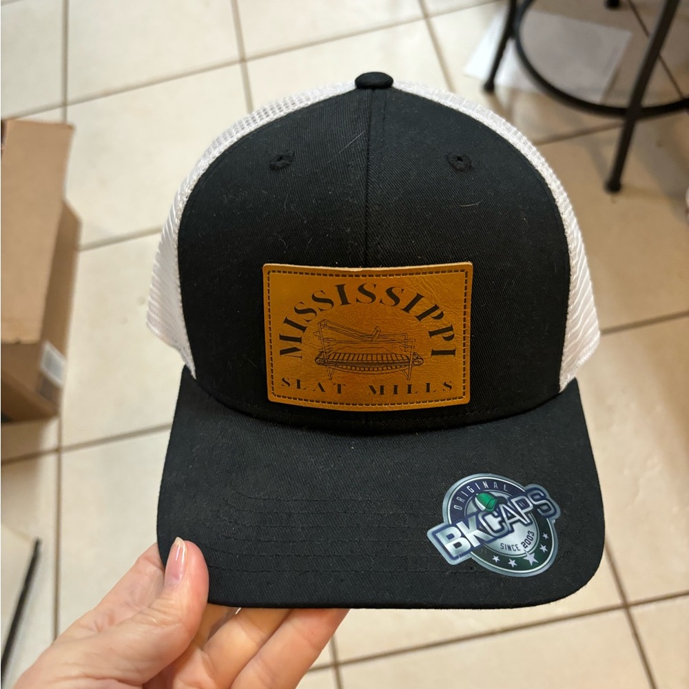 NWOT OS BK Caps leather patch “Mississippi slat Mill” black mesh/snap back cap.